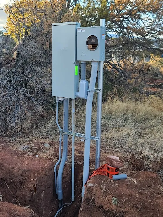 Meter pedestal and conduit in an open trench